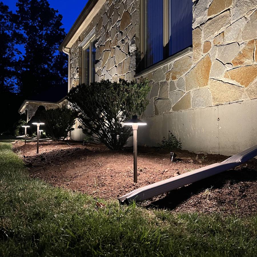 Canton stone entry with landscape lighting and path lights