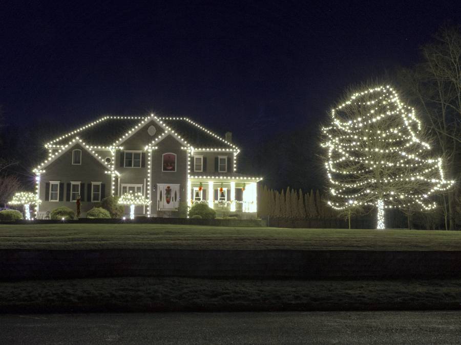 Wide Christmas roofline lighting on a residential home