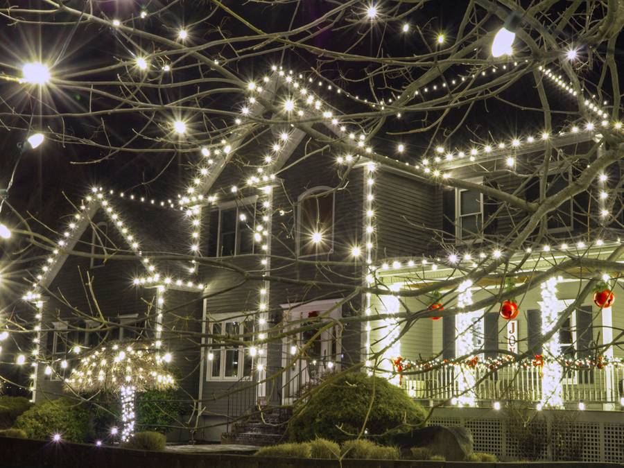 White holiday lights on a residential roofline