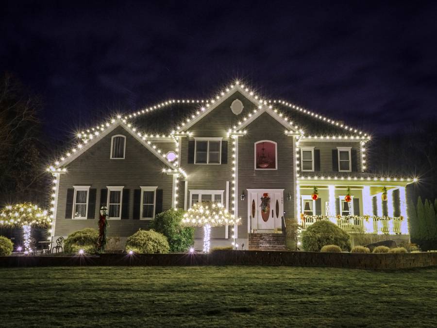 Classic white Christmas lights on a local home