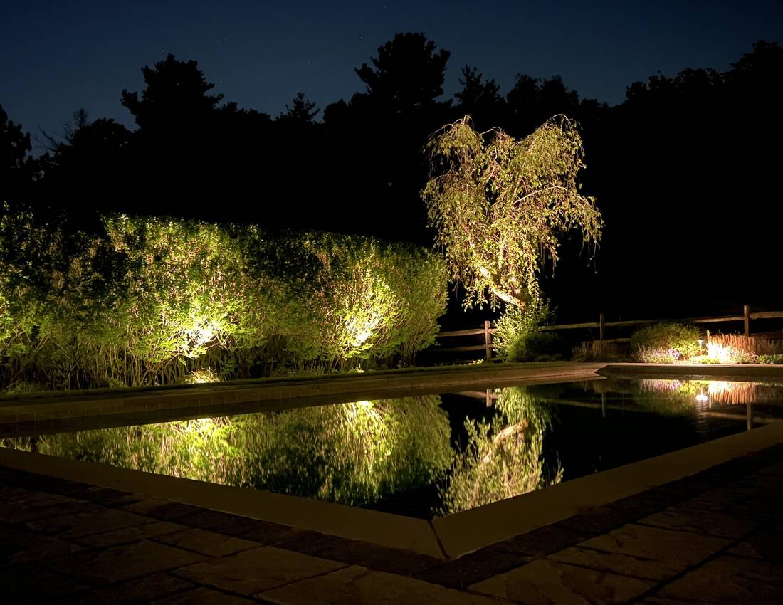 Outdoor lighting on a Massachusetts home and pool area