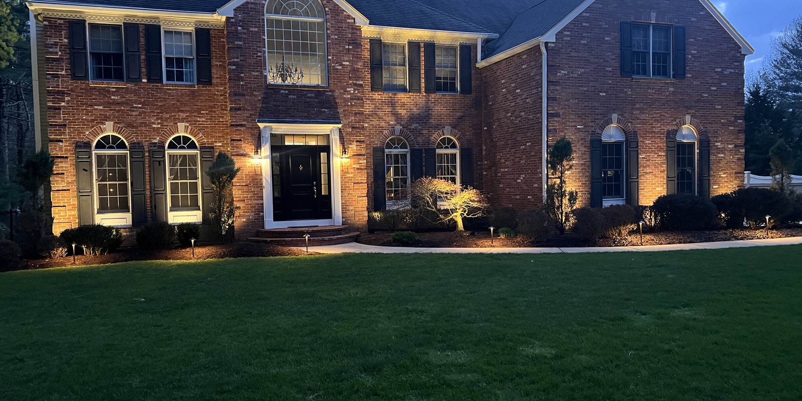 Permanent outdoor lighting installed on a Massachusetts home