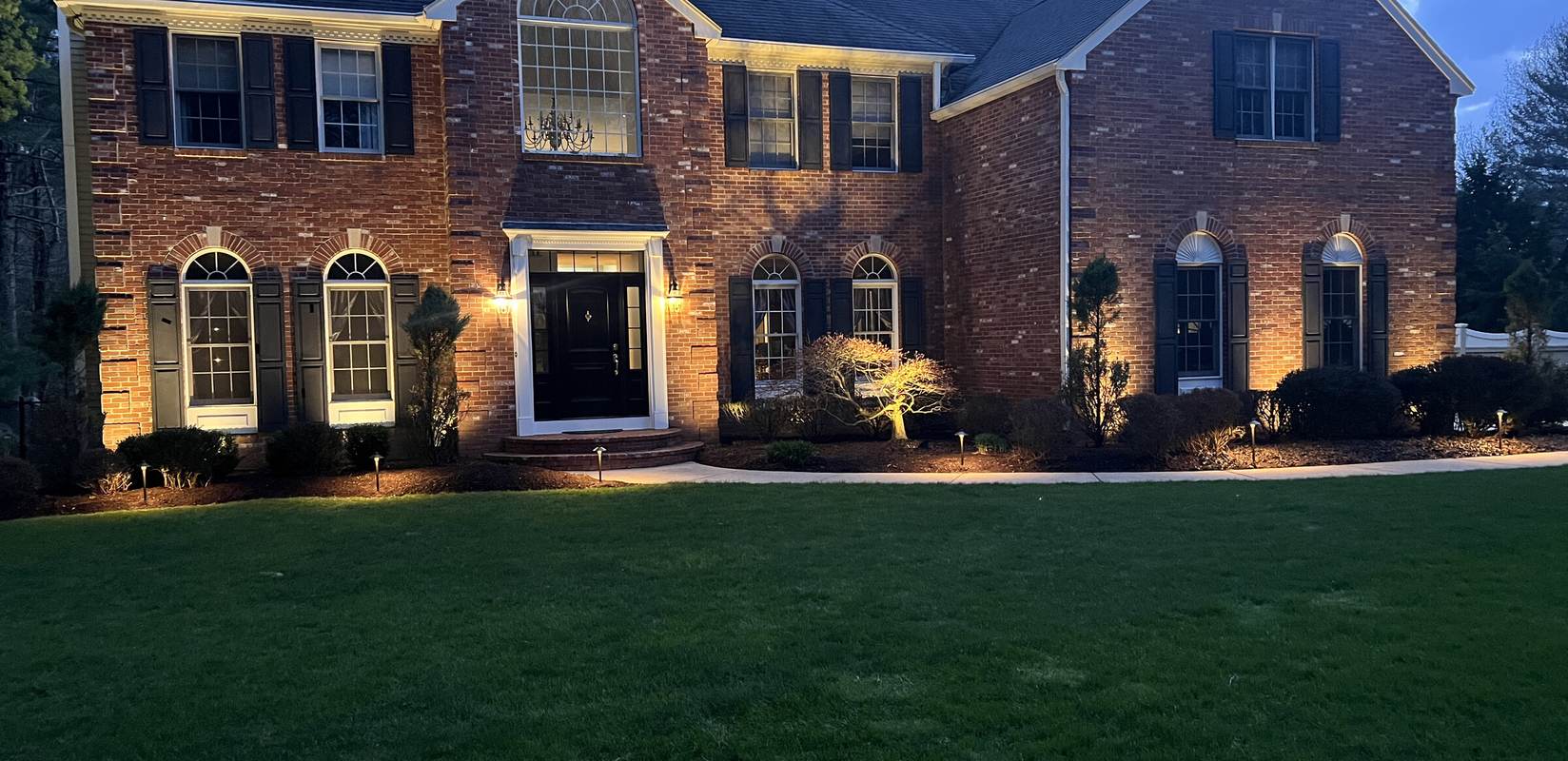 Permanent outdoor lighting installed on a Massachusetts home