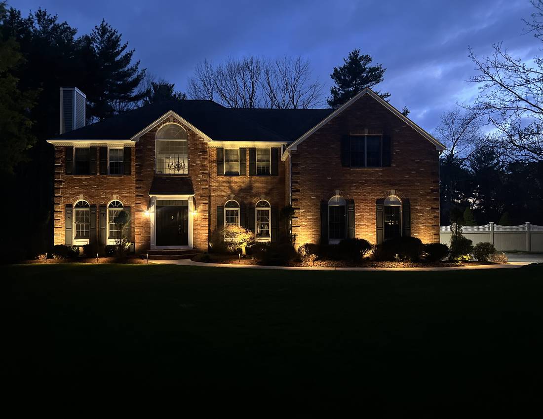 Permanent architectural outdoor lighting on a residential roofline