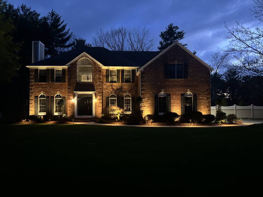 Permanent RGB roofline lighting on a home exterior