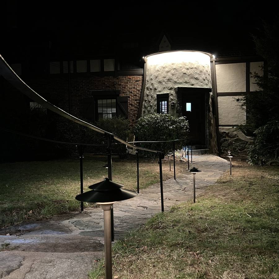 Warm pathway lighting on a residential walkway